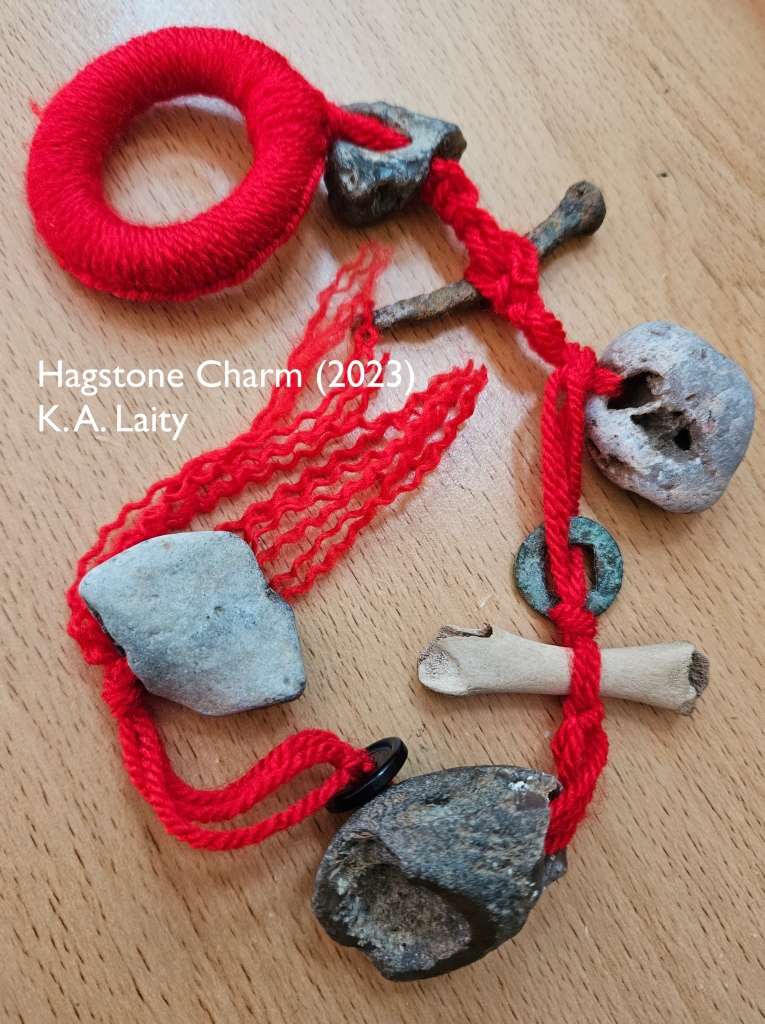 hagstone charm connecting stones with red fibre